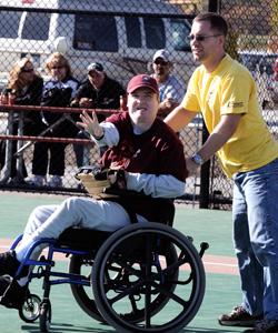 Man in wheelchair throwing baseball